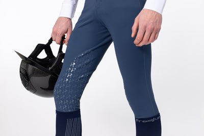 Front Close up of Uranus Blue Men's Freejump Breeches with silicone “Griptec” technology on inside leg.