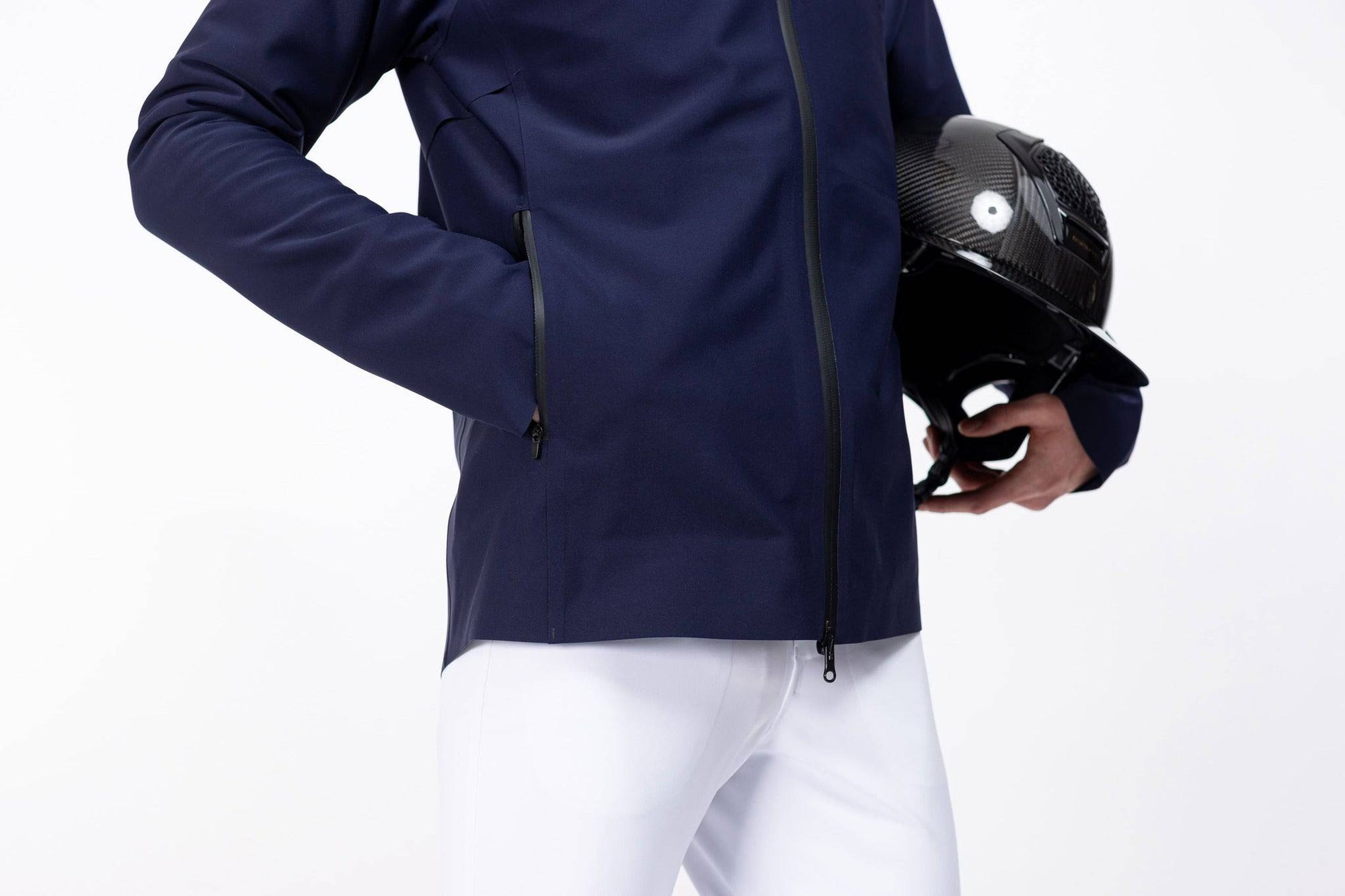 Close up of Pluto Navy Men's Freejump full zip Rain Jacket with zipper front pockets and dragonfly emblem on right shoulder.