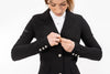 Close up of black Freejump Women's Show coat to show "freejump" on left sleeve and Laser-cut perforated bands on the bottom of the pockets and on the collar