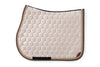 Beige Saddle Pad with Rhinestone and Tone on Tone Piping, and small Animo logo on bottom of pad.